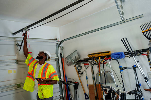 Professional Garage Door Roller Replacement technician working in Ellinwood, KS